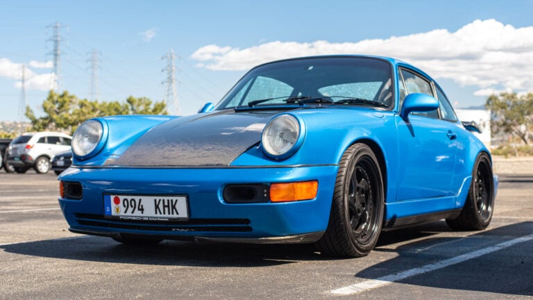 blue Porsche 964 on road