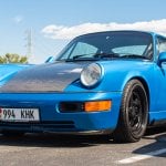 blue Porsche 964 on road