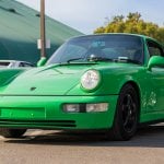 Green Porsche 964 on road