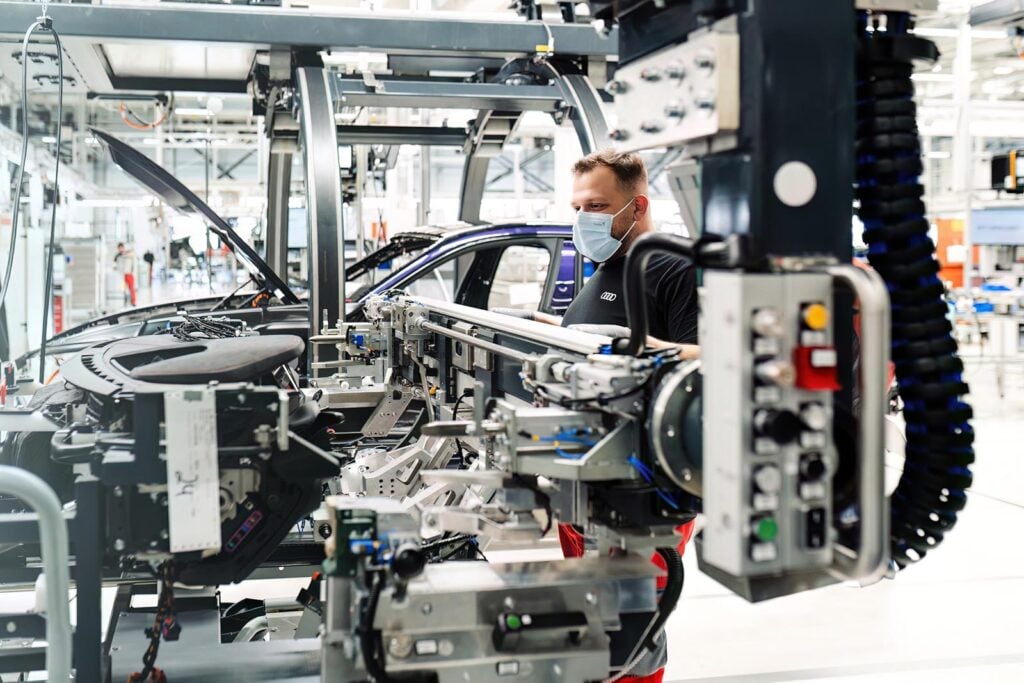 man working on Audi factory line