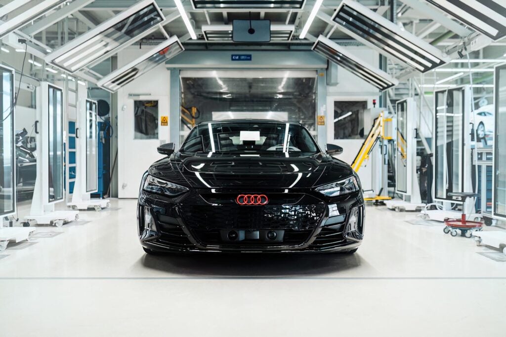 black Audi e-tron front shot in glass room