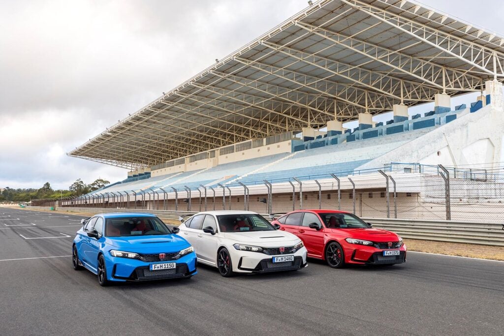 Blue White Red Honda Civic Type R next to eachother on racetrack