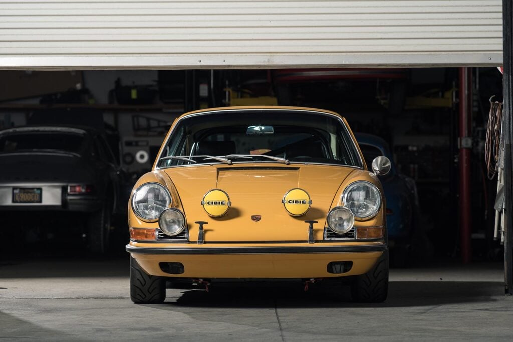 Front shot of a golden yellow Porsche
