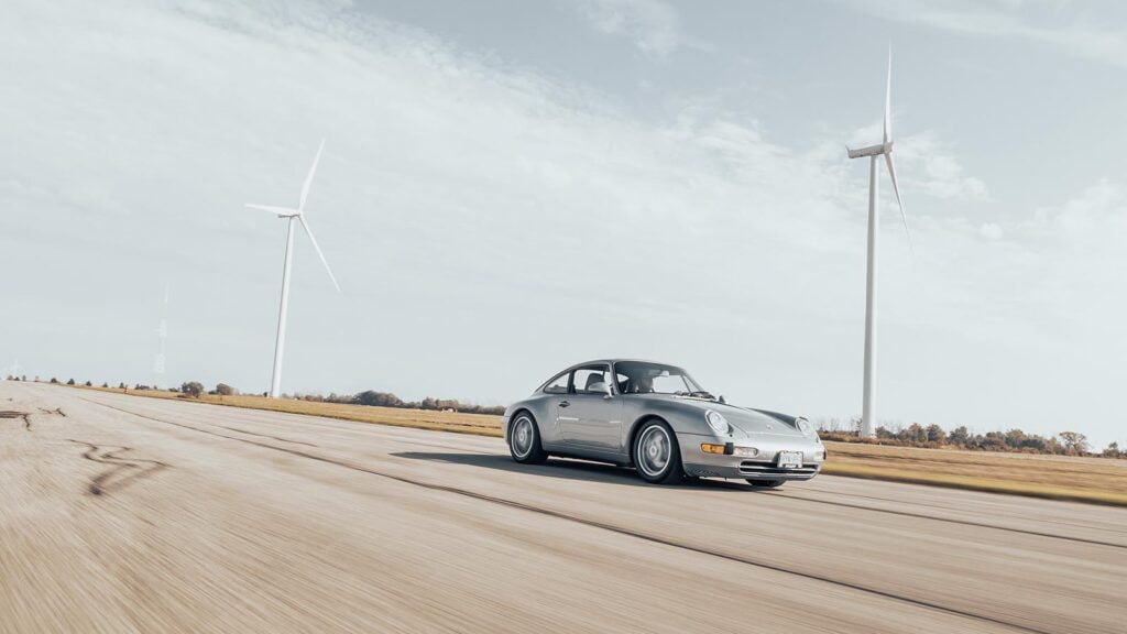 Grey Porsche driving on track