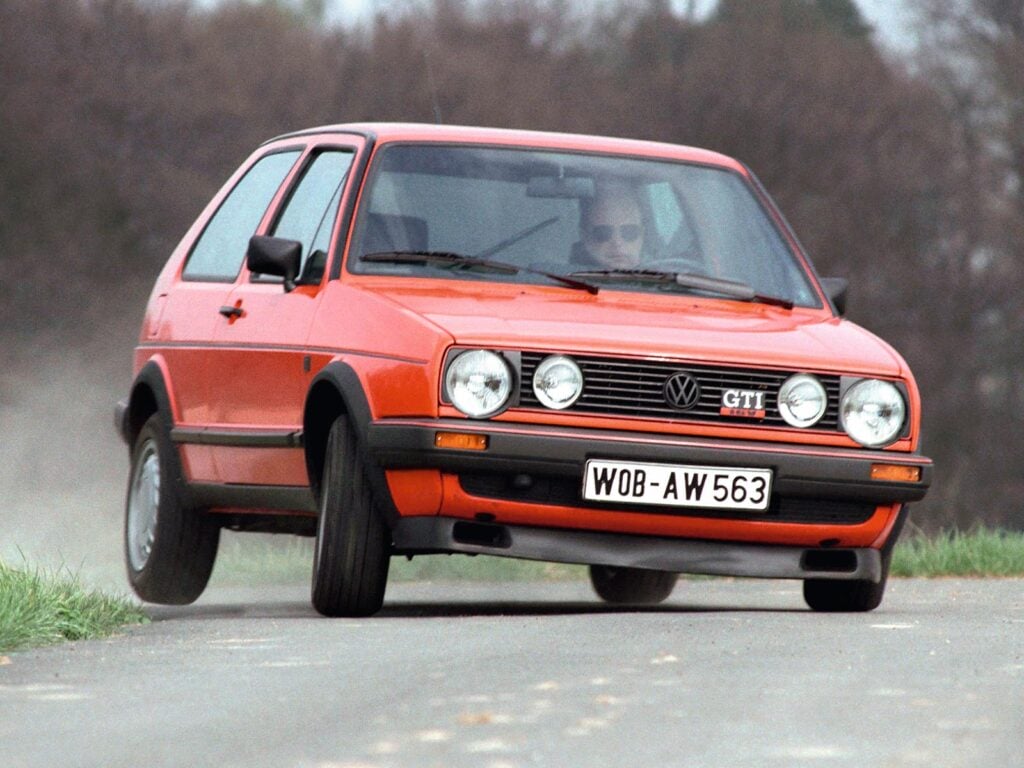 Red 1978 VW GTI taking a sharp turn