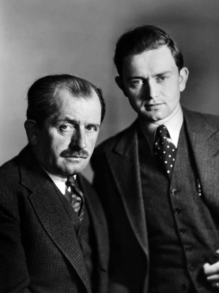 black and white portrait of two men staring