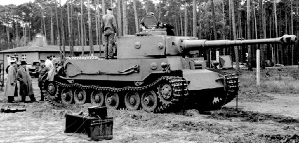 Black and white photo tank with soldiers around it