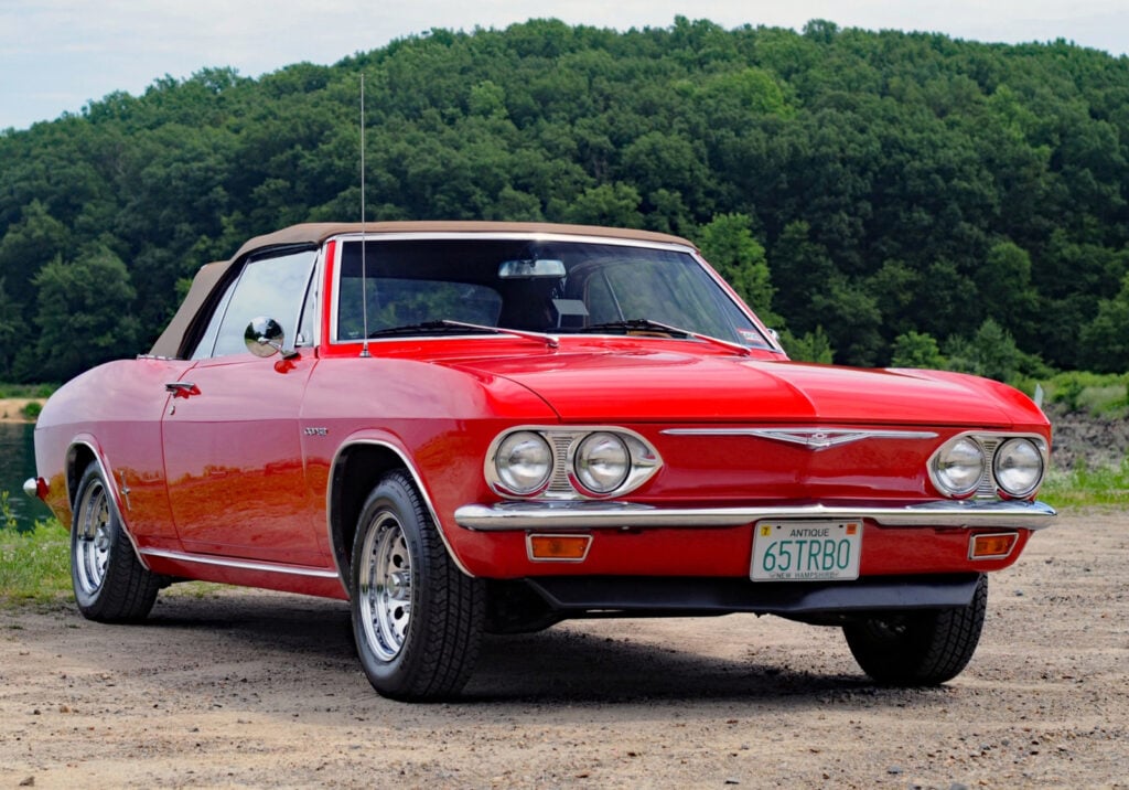 Red Chevy Corvair parked on road