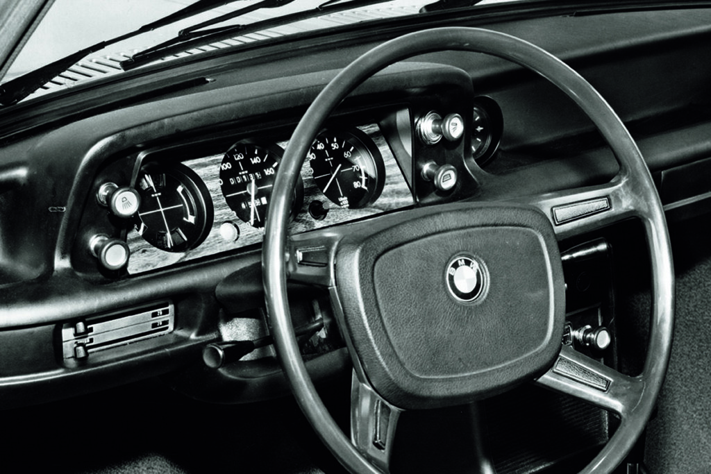 black and white photo of a BMW 02 dashboard 