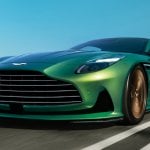 Green Aston Martin DB12 Super Car on a road during a clear blue day