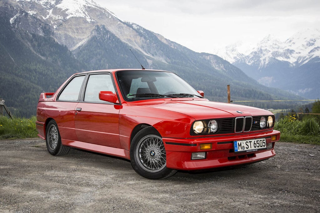 red bmw e30 m3 in the mountains
