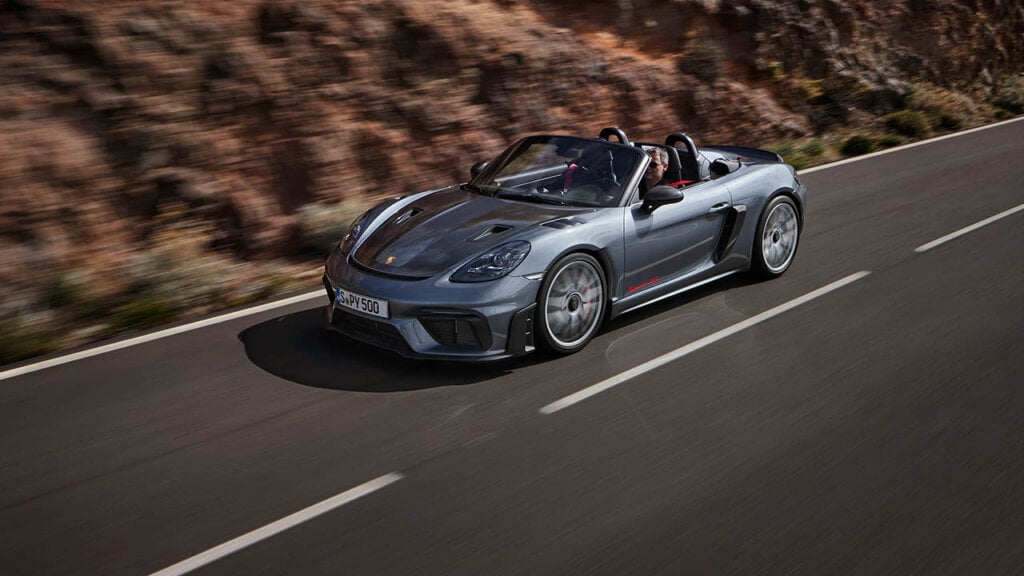 a grey porsche spyder cruising through canyons