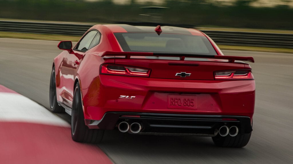 Red 2023 Chevrolet Camaro ZL1 racing on a track