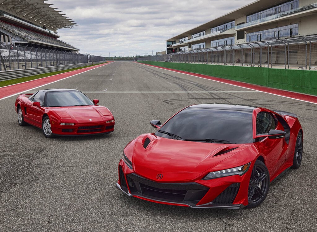 two red acura nsx on a racetrack