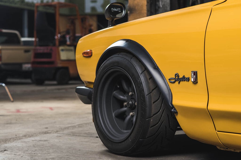 front diver side of a yellow nissan hakosuka gt-r