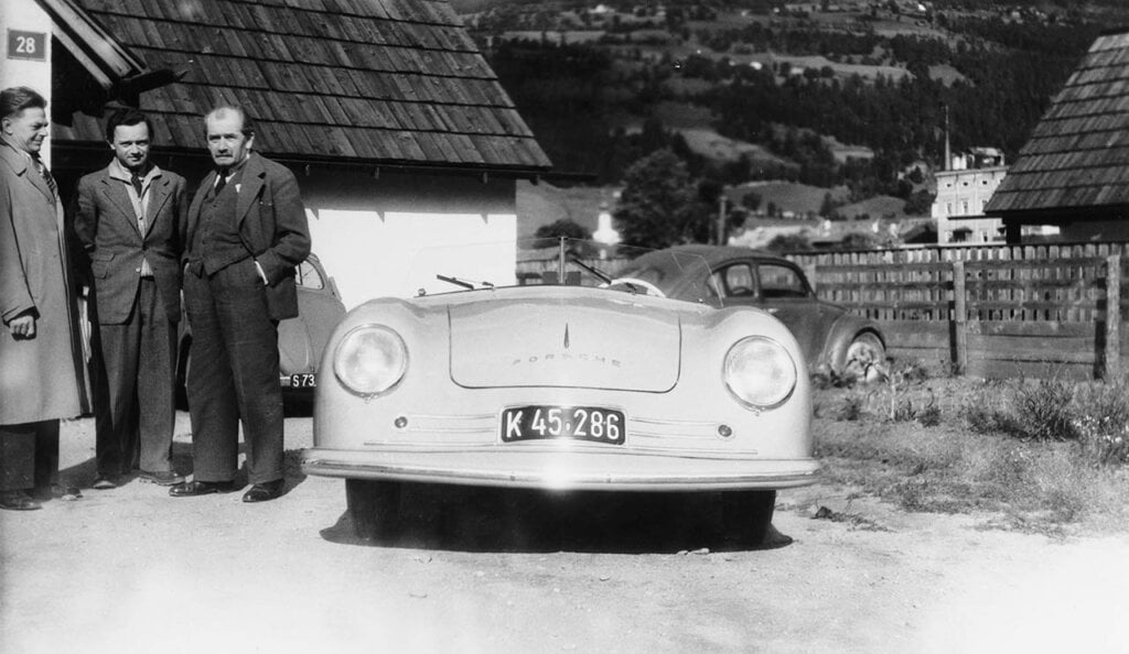 Ferry Porsche (centre), his father Ferdinand Porsche (right) and Erwin Komenda with the 356 No. 1 Roadster 