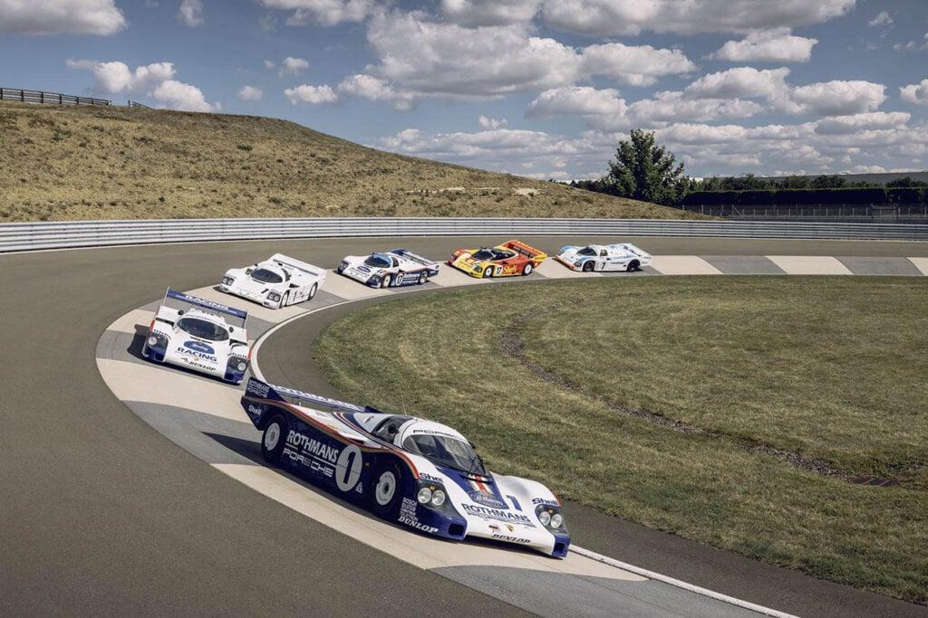 group of porsche race cars with liveries 