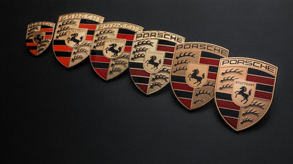 the new Porsche symbol next to all previous versions