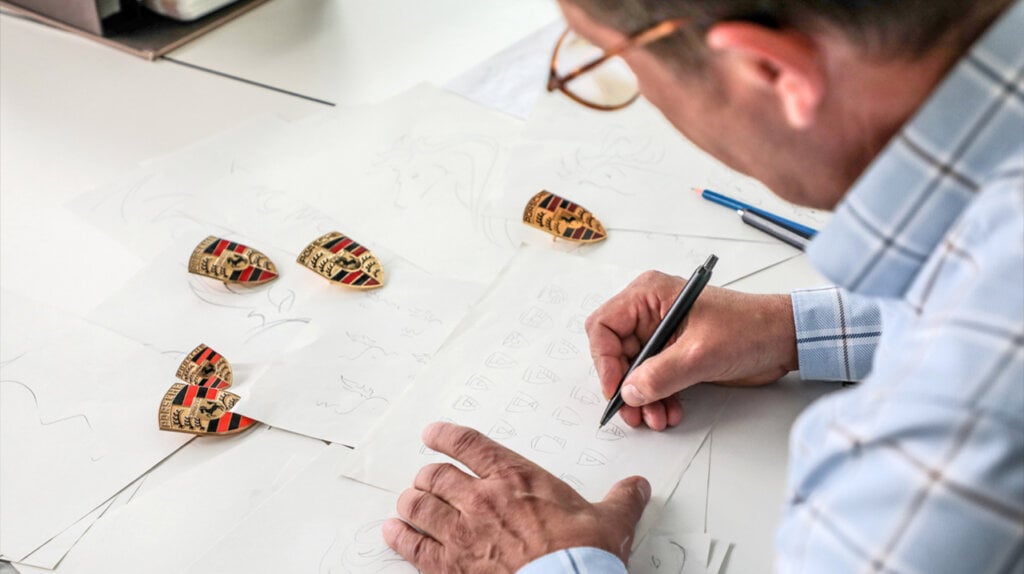 Porsche designer sketching new ideas for the Porsche crest