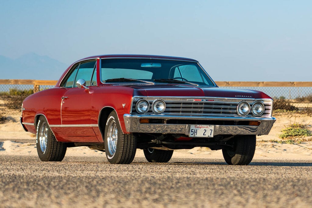 red 67 chevelle malibu by the beach