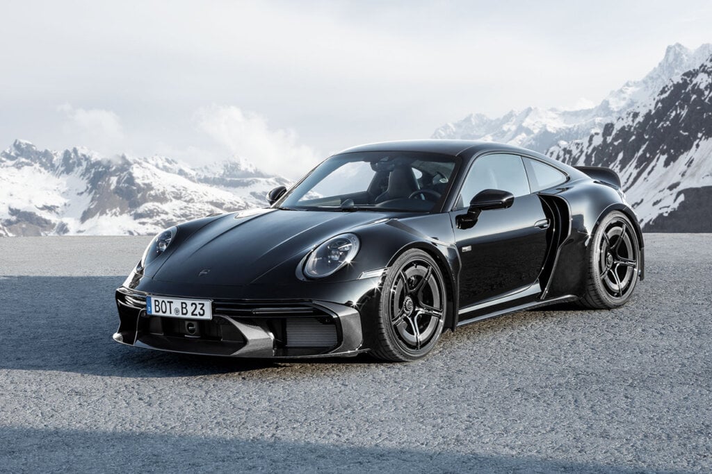 black Turbo S on road with ice mountains in background