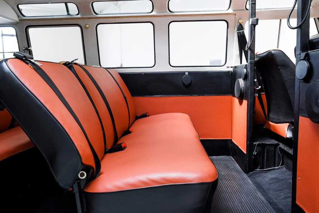 black and orange interior seats and windows behind them