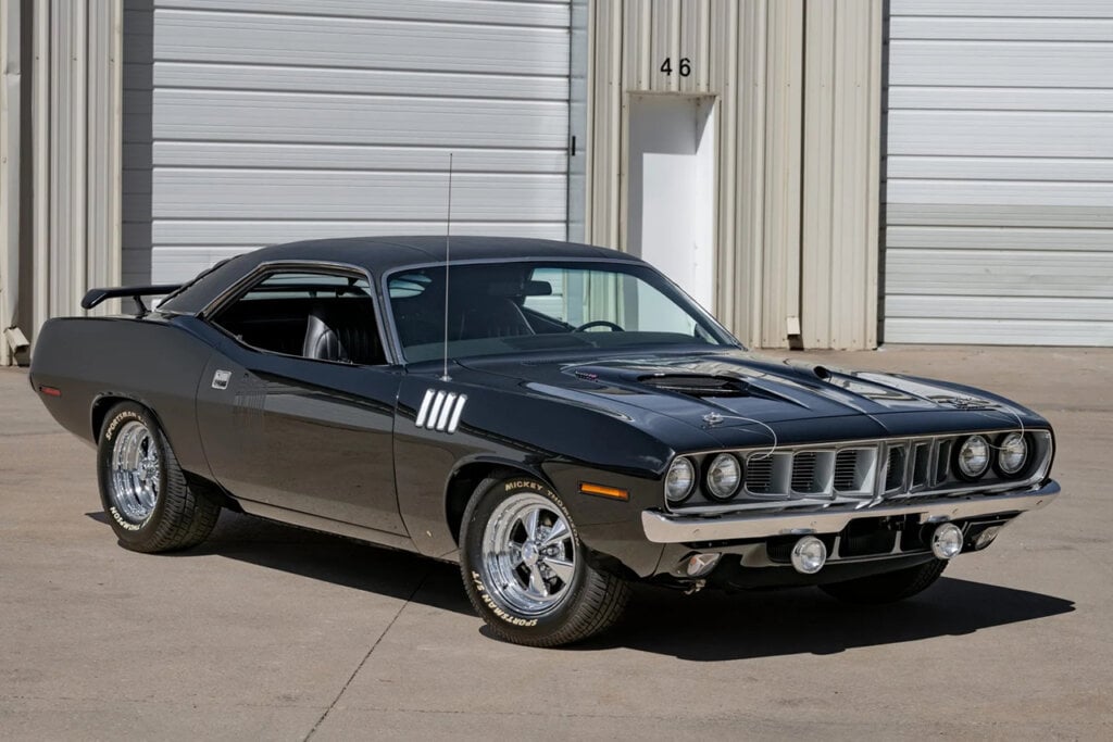 Plymouth 'Cuda in front of doors