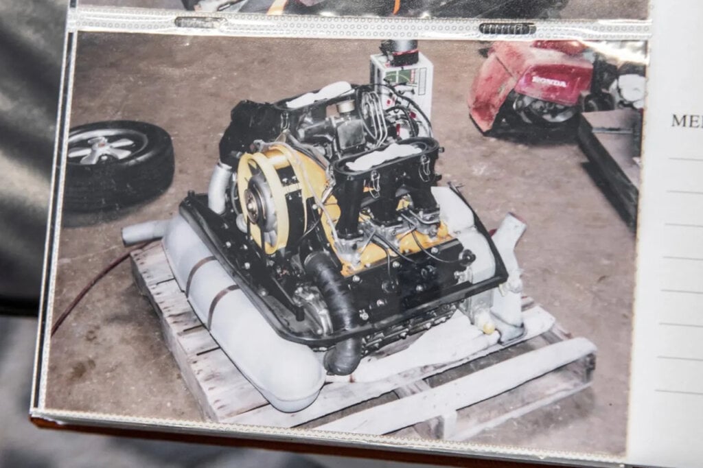 an old photo of a flat six engine on a wooden pallet