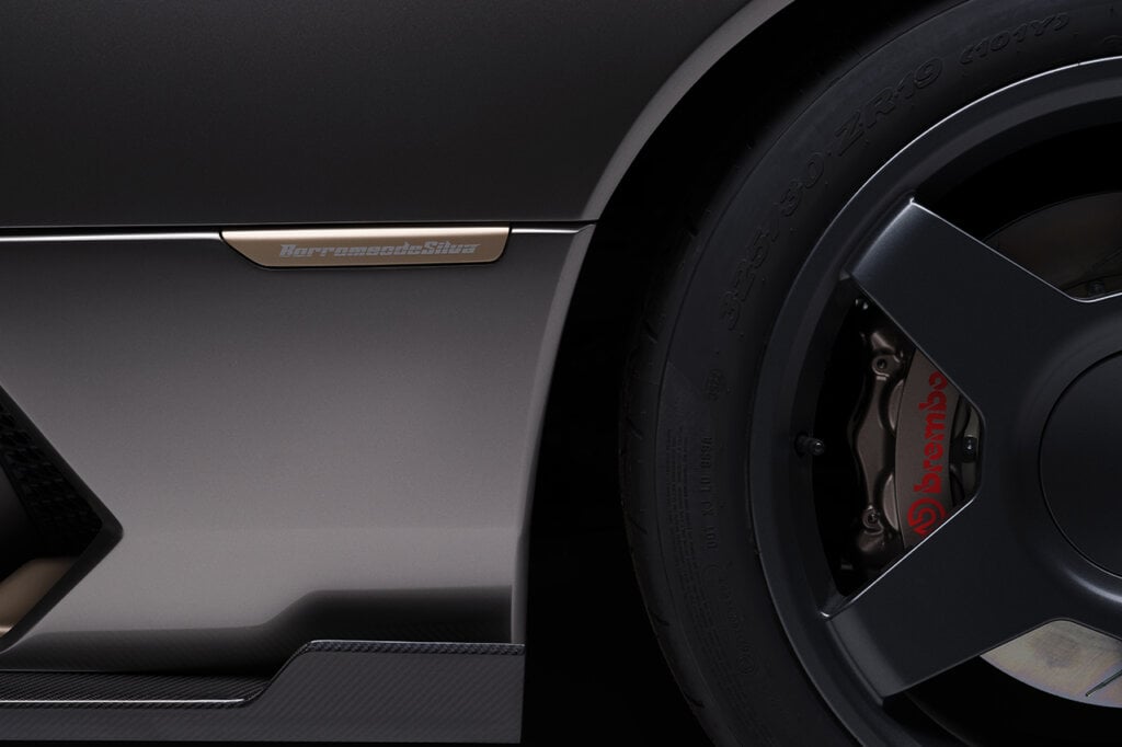 Badge on side of car next to the wheel. The badge says BorromeodeSilva