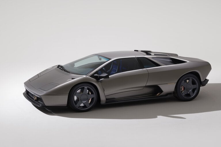 Silver Lamborghini Diablo parked in white room