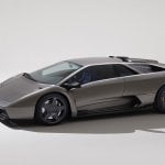 Silver Lamborghini Diablo parked in white room