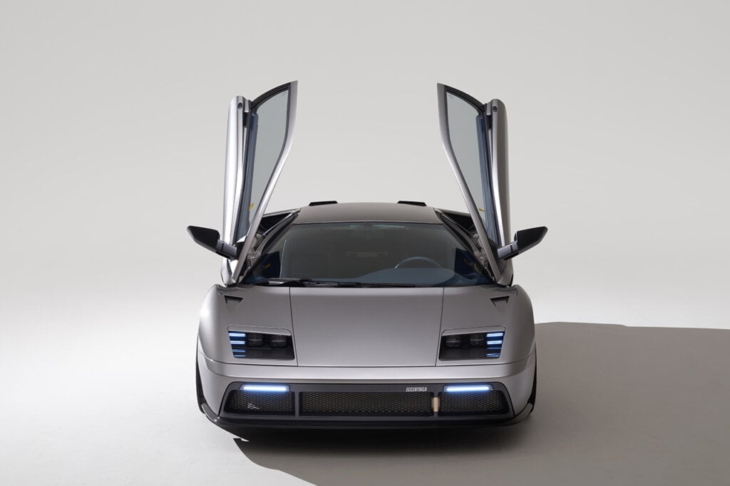 Front shot of Eccentrica car with doors open. Car is in the white room