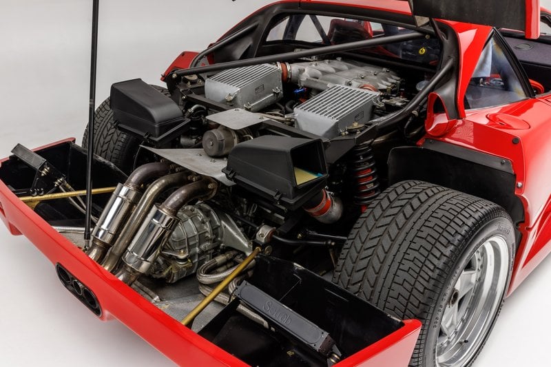detailed shot of the mid engine V8 engine for the Ferrari. Twin radiators and ducts, center exit exhaust by the engine