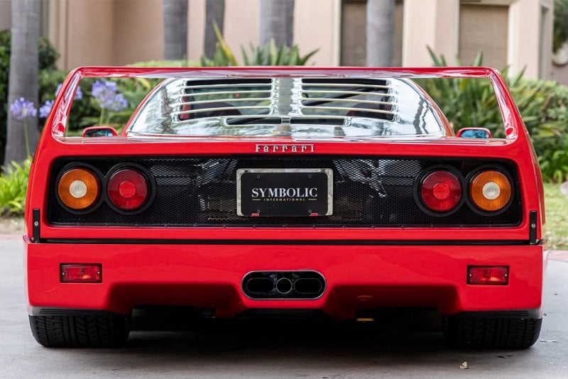 rear end of the Ferrari F40 infront of a house