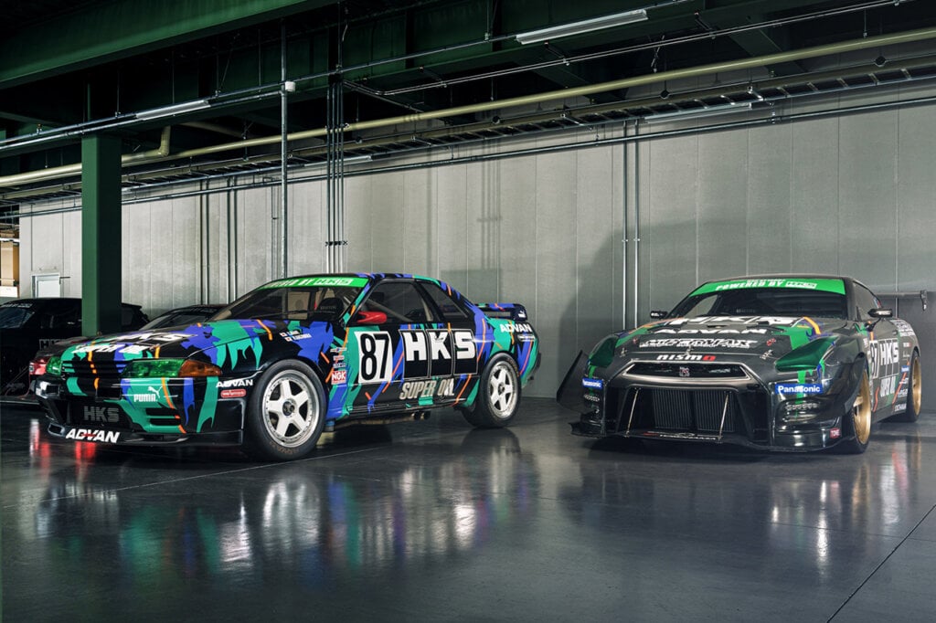 Two Skylines with HKS liveries in a concrete garage