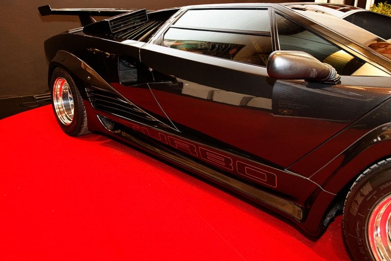 Black Turbo S Countach on red carpet