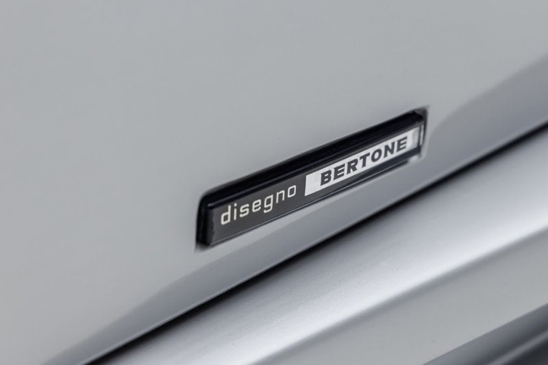 Countach Badge that says disegno bertone in black and white 