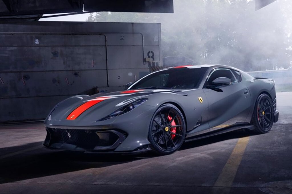 Blue grey Ferrari 812 Competizione with red stripe in a garage