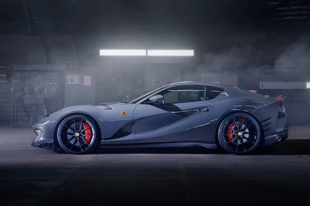 side profile of Novitec Ferrari in a concrete garage, 1 light bar above it