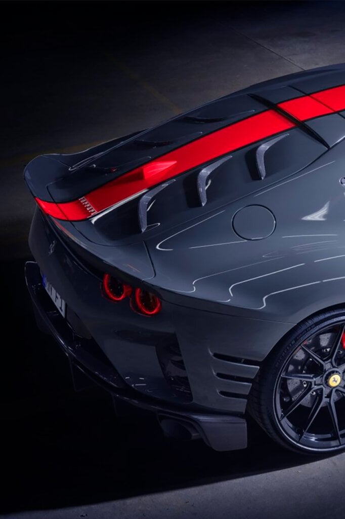 rear side of the 812 with a red stripe going over the back of the car, black background