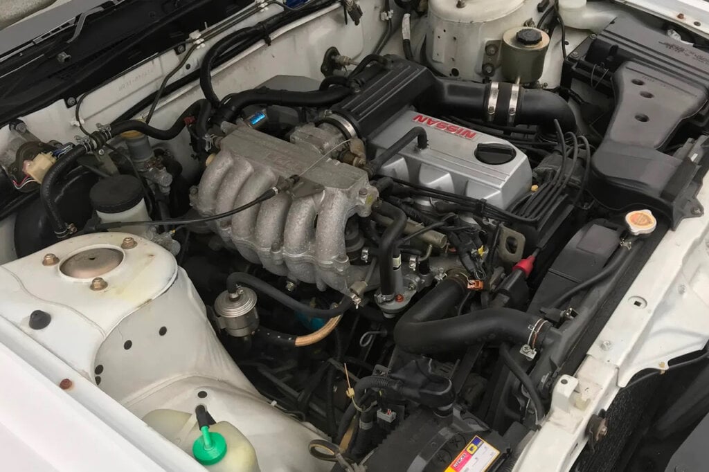 RB20DE engine in side of a white car