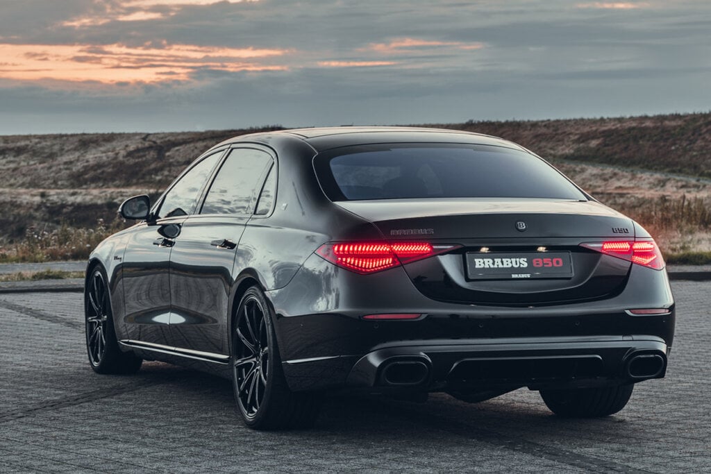 rear shot of dark grey Brabus 850 with sunset
