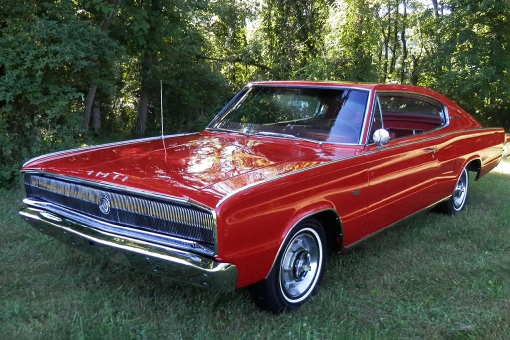 1966 red dodge charger parked on grass