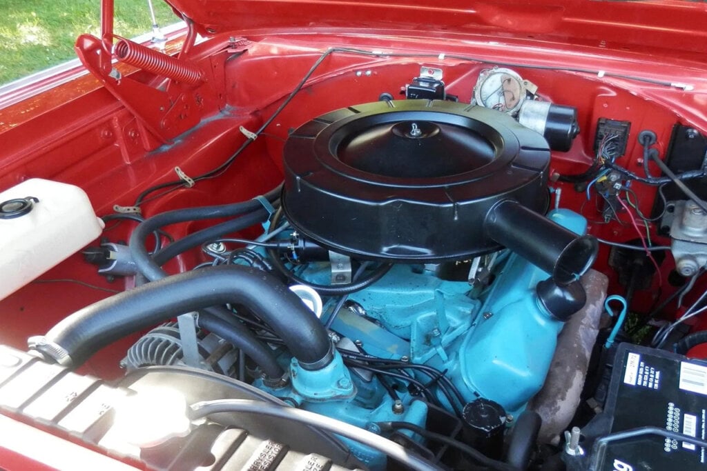 engine closeup for a red dodge charger
