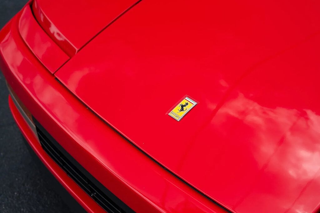 Ferrari Badge on the hood of a red Testarossa