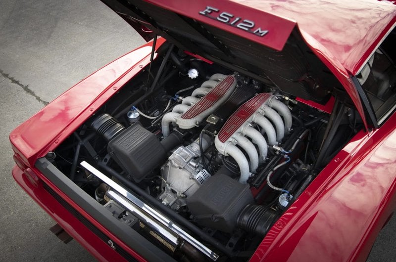 Red 512M Testarosso 12 cylinder engine with red plates on the intake manifolds with a silver 512M badging on the right of the trunk