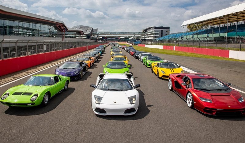 various lambo cars on a race track