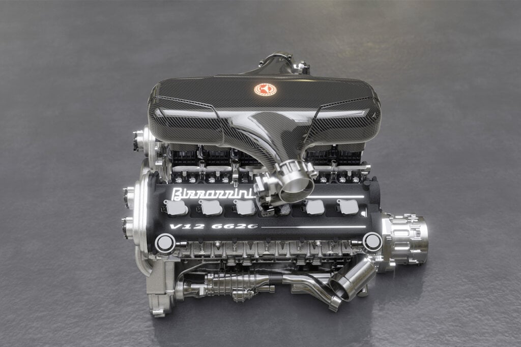 Shiny chrome silver V12 engine placed on the ground