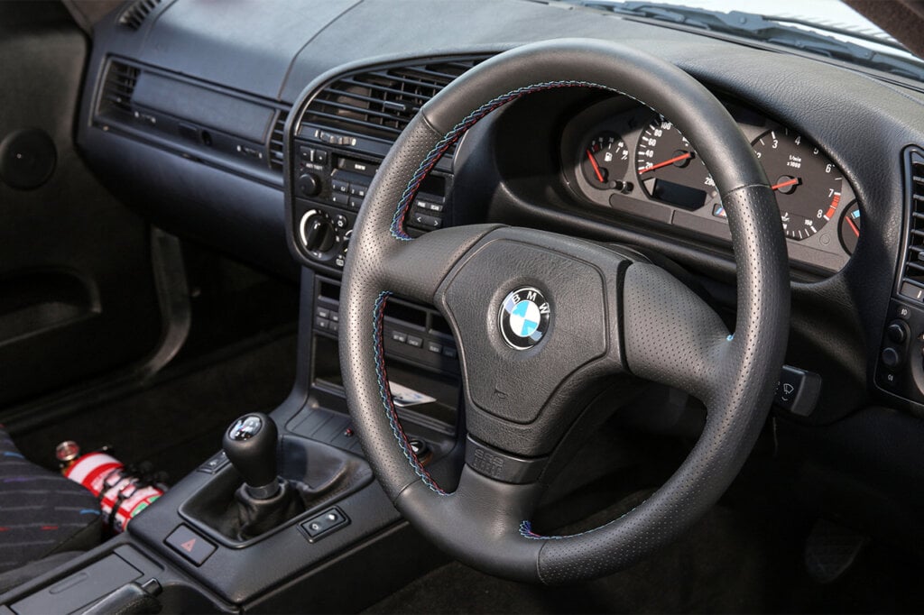BMW e36 M3-R M3 colors are stitched in the steering wheel and interior dashboard