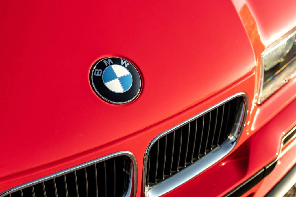 BMW badge on a red E36 M3